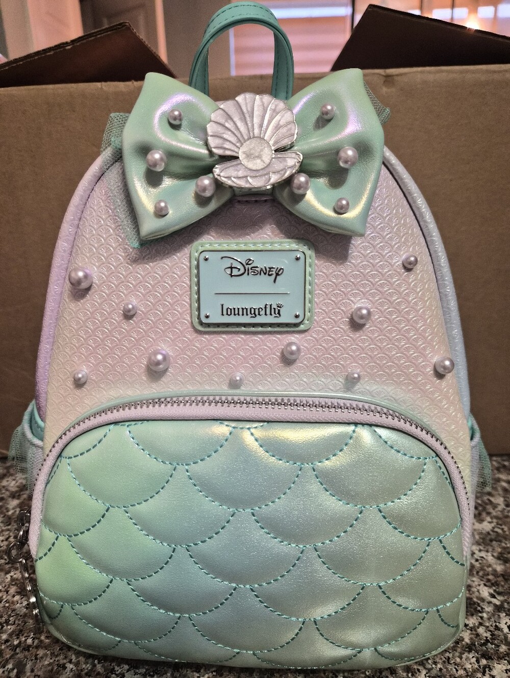 Loungefly Iridescent Mint and Pearl Ariel the Little Mermaid Backpack.